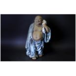 Large Chinese Stoneware Buddha Standing Carrying a Sack, Wearing a Glazed Blue Toga. Height 19