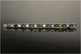 Late Victorian Bar Brooch Set With 19 Alternating Sapphires & Diamonds In A Square Millegrain