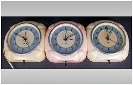 Art Deco Trio Of Matching Smiths English Wall Clocks with bakerlite surrounds. Colourways pink &