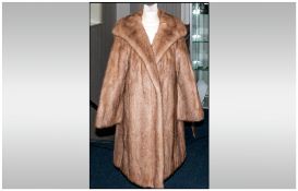 Ladies Three Quarter Length Honey Blonde Mink Coat. Fully lined, slit pockets. Hook & loop