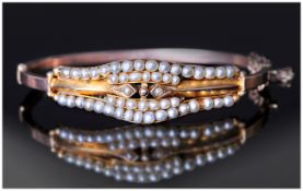 Victorian Ladies 9ct Rose Gold Seed Pearl Set Bangle, with Safety Chain. c.1880's. 8.7 grams.