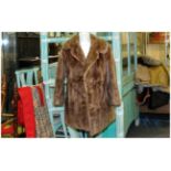 Ladies Pale Brown Musquash Jacket, fully lined, Collar with revers. Hook & loop fastening. Slit