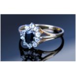 Ladies 9ct Gold Set Sapphire & Diamond Cluster Ring The central sapphire surrounded by 10 small