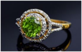 Peridot and Diamond Ring, a 2ct vivid green, round cut peridot set within two concentric circles,