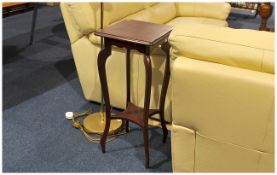 Edwardian Polished Mahogany Plant Stand standing on cabriole legs and with a stretched platform