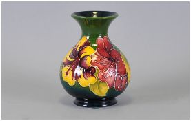 Moorcroft Globular Shaped Vase ' Hibiscus ' Design on Green Ground. Impressed Moorcroft Marks to