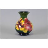 Moorcroft Globular Shaped Vase ' Hibiscus ' Design on Green Ground. Impressed Moorcroft Marks to