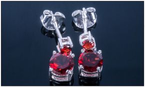 Deep Red Garnet Drop Earrings, round cut garnets suspended below smaller similar stones, 2.25cts