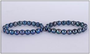 Pair of Peacock Fresh Water Pearl Bracelets, each matching bracelet comprising a row of peacock
