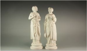 Pair of Parian Figures 'Muses of Art and Music', both dressed in Greco-Roman style, one looking