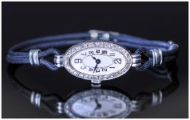 Ladies - 1930's Platinum and Diamond Cocktail Watch, Fitted to a Black Lace and Platinum Strap.