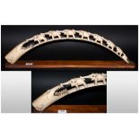 A Fully Carved Ivory Tusk of Large Size, Depicting a Herd of Elephants, Tail to Tail Walking Into