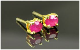 Pair of Ruby Stud Earrings, oval cut rubies set in 14ct gold vermeil and silver post and push back