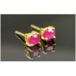 Pair of Ruby Stud Earrings, oval cut rubies set in 14ct gold vermeil and silver post and push back