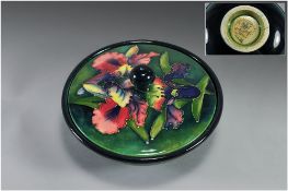 William Moorcroft Impressive Lidded Bowl ' Orchids ' Design on Emerald Green Ground. Label to Base