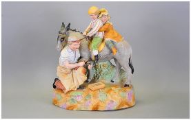 A Fine 19th Century German Handpainted Bisque Figure Group of two small children seated upon a