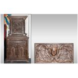 A Dutch Flemish Carved Oak Cabinet on cupboard base, profusely decorated with elements of earlier