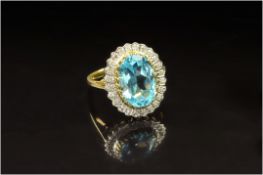 9ct Gold Diamond Dress Ring, Set With A Central Blue Topaz Surrounded By Diamond Chips, Fully