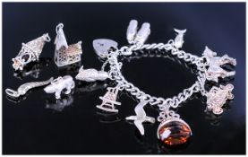 Silver Charm Bracelet With 8 Attached Charms Together with 4 Loose Silver Charms