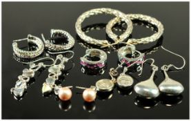 Seven Pairs Of Silver Earrings