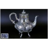 A German Late 19th Century Very Ornate Embossed Silver Teapot, with Raised Bird and Floral