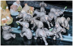 12 Ceramic Elephants by Lenox. Comprising Eating, Resting, Discovering, Carrying, Stretching,