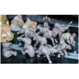 12 Ceramic Elephants by Lenox. Comprising Eating, Resting, Discovering, Carrying, Stretching,