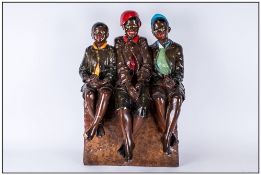 Large Chalk Figure Group Of Three Black Children sitting cross legged on a seat. 22'' in height,