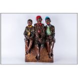 Large Chalk Figure Group Of Three Black Children sitting cross legged on a seat. 22'' in height,