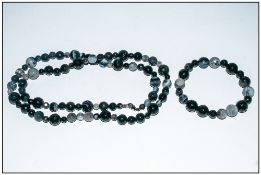 Monochrome Botswana Agate Long Necklace and Bracelet, both comprising faceted round agate beads in