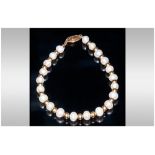 A Fine Cultured Pearl Bracelet with Gold Spacers and 18ct Gold Clap, Marked 750. 7 Inches In