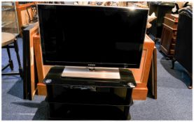 Samsung 32 inch Flat Screen TV and black polished glass stand