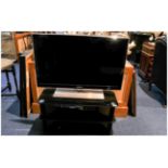 Samsung 32 inch Flat Screen TV and black polished glass stand