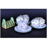 Shelley 'Rosebud' Part Teaset comprising 5 cups and 6 saucers. Together with a Carlton Ware Toast