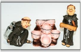 Three Resin Humorous Monk Figures one in the form of an egg carrier and on as a corkscrew & one a