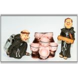Three Resin Humorous Monk Figures one in the form of an egg carrier and on as a corkscrew & one a