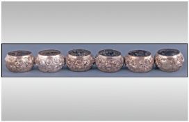 A Good Set Of Six Indian Colonial Silver Napkin Rings. Each of baluster shape with raised figures