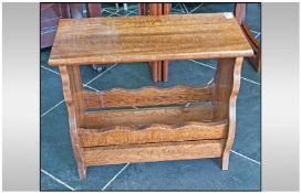 Small Oak Side Table Magazine Stand with shaped sides.