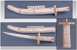 A Decorative Ivory Sword & Scabbard, carved in the oriental style with a Phoenix bird in flight. A/