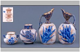 Pair of Doulton Burslem Miniature Ewers, the vertically ridged bell shaped bodies decorated with