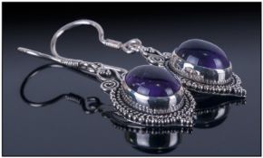 Pair of Amethyst Drop Earrings, oval cabochon cut, rich purple stones of 7.5cts, set in hand crafted