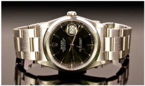 Rolex Oyster Perpetual Date Just Brush Steel And Black Dial Gents Wrist Watch. Date 2000. Serial