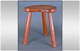 Mouseman Three Legged Oak Milking Type Stool by Thompson of Kilburn, Yorkshire, with a shaped seat