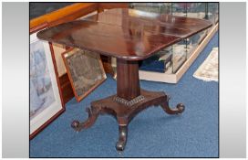 Victorian Pedestal Tea Table, hinged swivel top, raised on quatrefoil base.