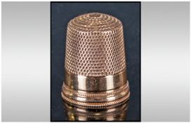 A Continental Gold Thimble, with plain rim and beaded edges. Unmarked but tests gold.