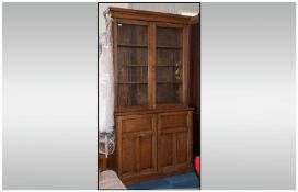 Early Twentieth Century Oak Glazed Bookcase with three shelves over storage base, approx 90 inches