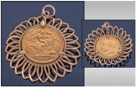 George V 22ct Gold Half Sovereign set in a 9ct gold pendant. Date 1911. Total gold weight 7.7grams.