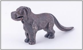 An Early 19th Century Cast Iron Nut Cracker In The Form Of A Dog. With a large tail. Height 4