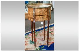 A Small Oval Shaped Two Drawer French Style Ormolu Mounted Bedside Table, brass gallery top on