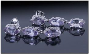 Rose de France Amethyst Triple Drop Earrings, each earring comprising three marquise cut amethysts